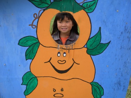 Kasen posing with a pumpkin